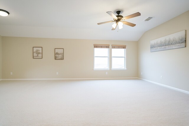7902 Crystal Moon Dr, Houston, TX 77040 - carpeted spare room featuring vaulted ceiling, baseboards, and a ceiling fan
