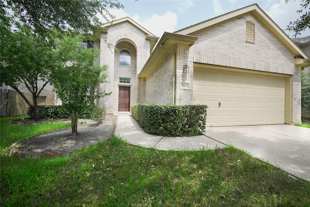 7902 Crystal Moon Dr, Houston, TX 77040 - view of front of home featuring brick siding, driveway, and an attached garage