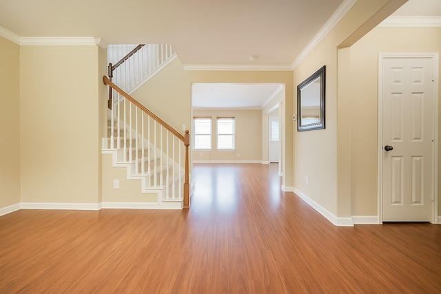 7902 Crystal Moon Dr, Houston, TX 77040 - foyer entrance featuring wood finished floors, stairway, crown molding, and baseboards