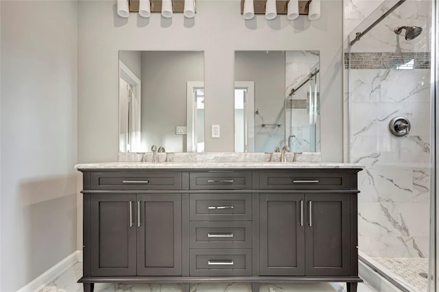 6814 Dumble St, Houston, TX 77021 - bathroom featuring marble finish floors, a marble finish shower, double vanity, and baseboards