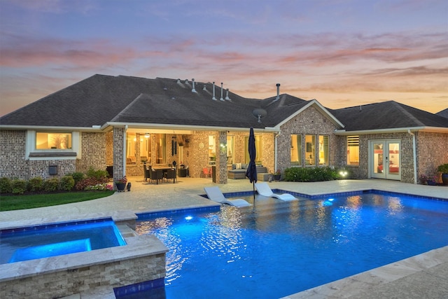 21514 Fairhaven Creek Dr, Cypress, TX 77433 - view of swimming pool featuring french doors, a patio area, and a pool with connected hot tub