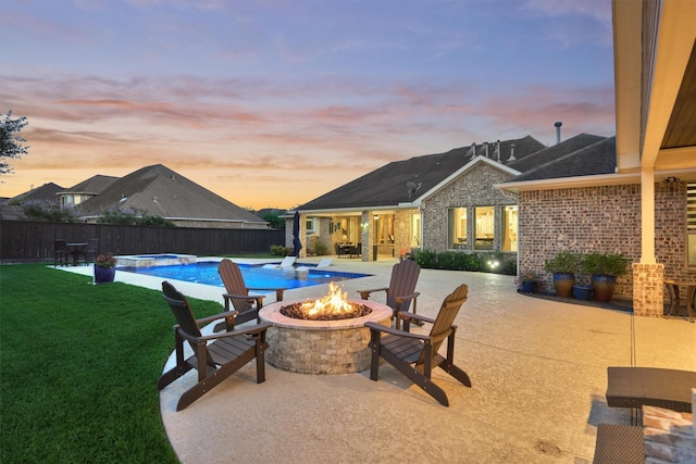 21514 Fairhaven Creek Dr, Cypress, TX 77433 - pool at dusk with a fire pit and a patio area
