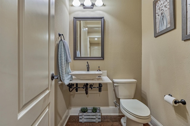 21514 Fairhaven Creek Dr, Cypress, TX 77433 - bathroom featuring baseboards, a sink, and toilet