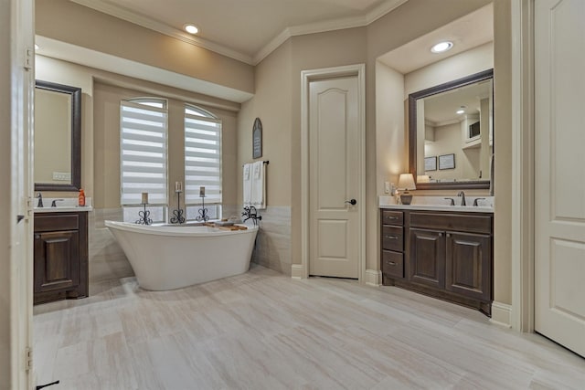 21514 Fairhaven Creek Dr, Cypress, TX 77433 - full bathroom featuring a freestanding tub, vanity, crown molding, tile walls, and recessed lighting