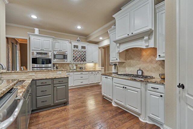 21514 Fairhaven Creek Dr, Cypress, TX 77433 - kitchen with gray cabinetry, stainless steel appliances, a sink, white cabinetry, and crown molding