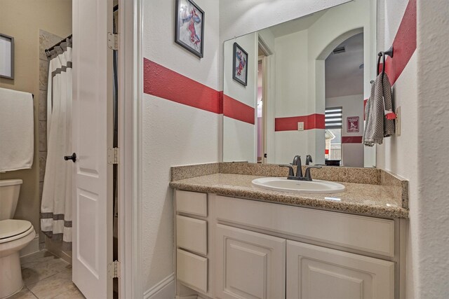 21514 Fairhaven Creek Dr, Cypress, TX 77433 - bathroom with toilet, vanity, tile patterned flooring, a textured wall, and curtained shower