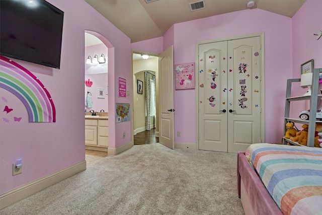 21514 Fairhaven Creek Dr, Cypress, TX 77433 - bedroom featuring light colored carpet, vaulted ceiling, arched walkways, a closet, and ensuite bathroom