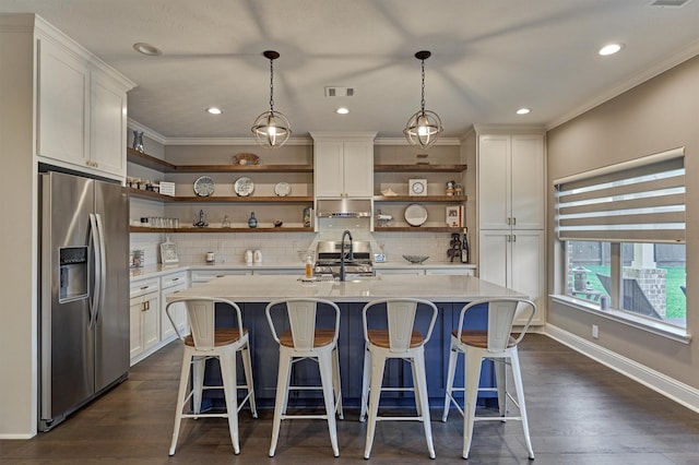 21514 Fairhaven Creek Dr, Cypress, TX 77433 - kitchen with appliances with stainless steel finishes, open shelves, light countertops, a sink, and crown molding