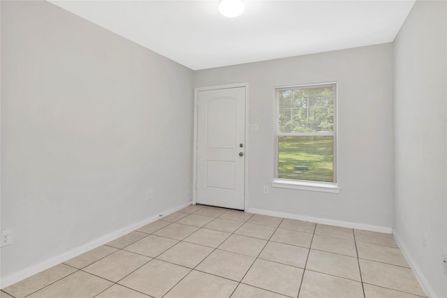 4079 Frontier Rd, Willis, TX 77378 - spare room with light tile patterned flooring and baseboards