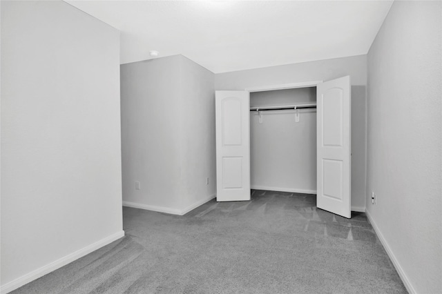4079 Frontier Rd, Willis, TX 77378 - unfurnished bedroom featuring carpet, baseboards, and a closet