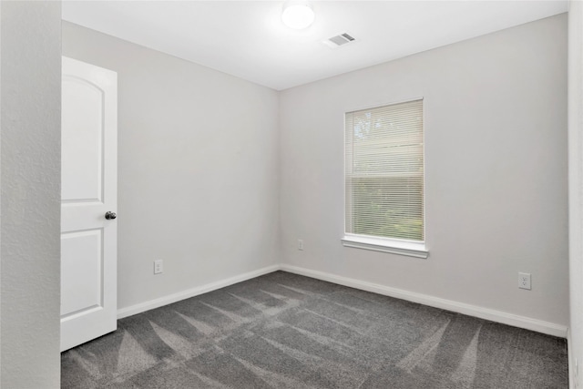 4079 Frontier Rd, Willis, TX 77378 - spare room with dark carpet and baseboards