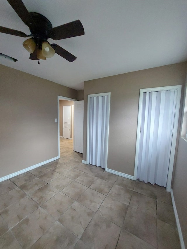 1707 W 7th St, Freeport, TX 77541 - empty room with a ceiling fan, baseboards, and light tile patterned floors