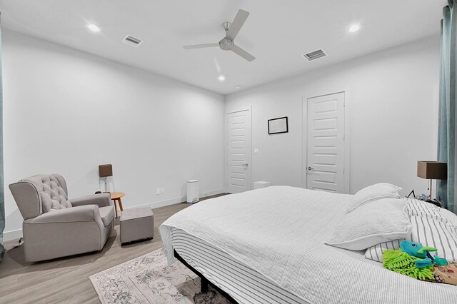 6827 Rocinante Ln, Houston, TX 77092 - bedroom featuring light wood finished floors, recessed lighting, baseboards, and a ceiling fan