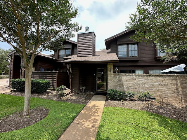 2611 Grants Lake Blvd Unit 237, Sugar Land, TX 77479 - view of front facade with a chimney