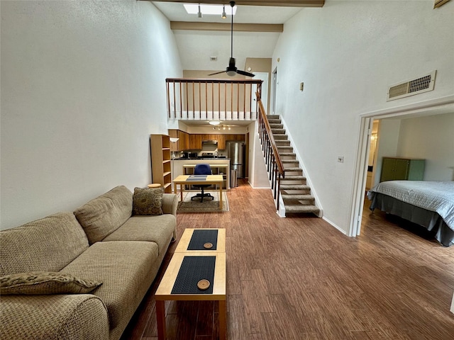 2611 Grants Lake Blvd Unit 237, Sugar Land, TX 77479 - living room with high vaulted ceiling, a ceiling fan, stairs, wood finished floors, and baseboards