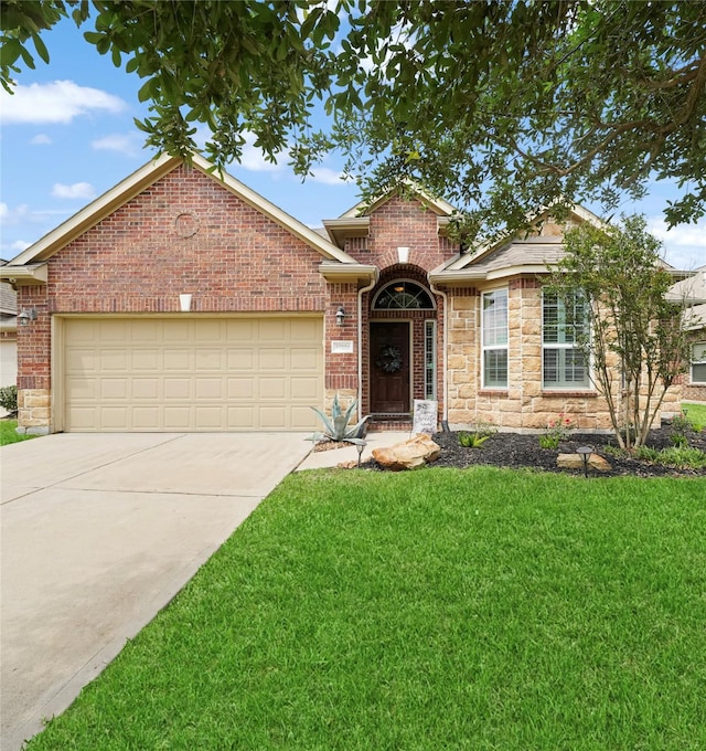 29954 Spring Creek Ln, Brookshire, TX 77423 - traditional-style home with concrete driveway, a front lawn, an attached garage, stone siding, and brick siding