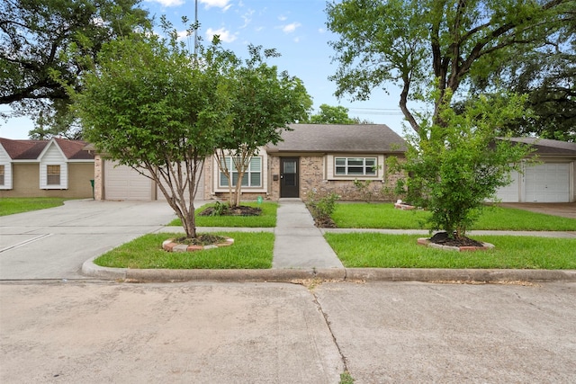 7727 Barberton Dr, Houston, TX 77036 - view of front of property featuring concrete driveway, a front lawn, and an attached garage