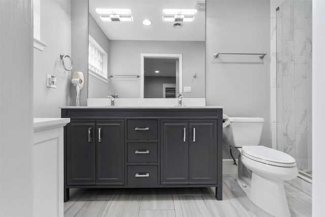 7727 Barberton Dr, Houston, TX 77036 - full bathroom with toilet, double vanity, a tile shower, and recessed lighting