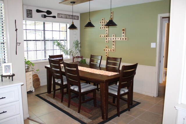 11615 Primwood Dr, Houston, TX 77070 - dining room with wainscoting and tile patterned floors
