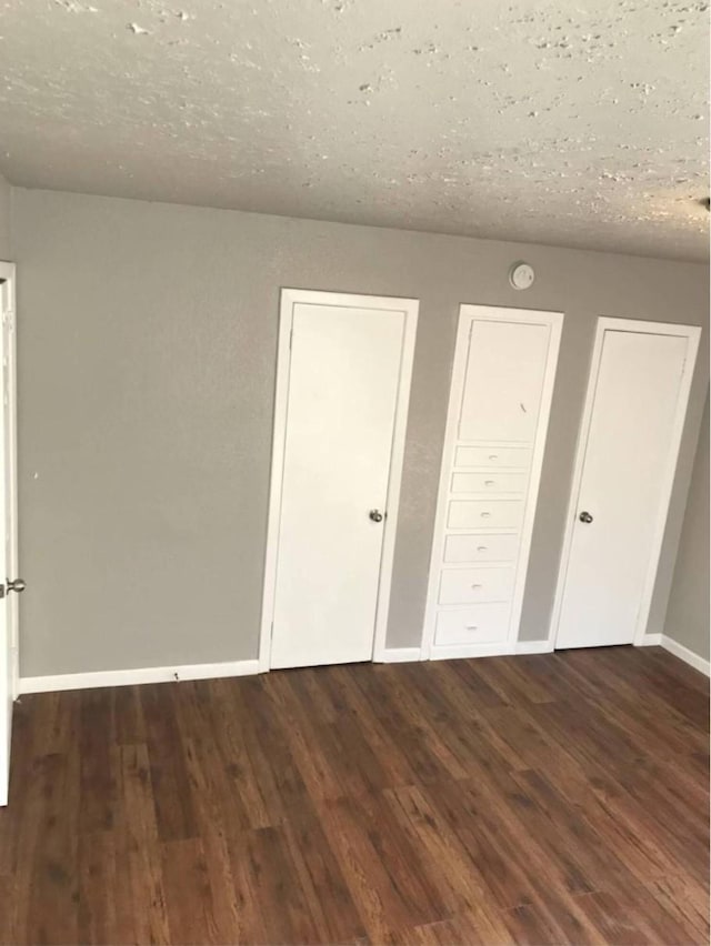 511 W Cleveland St, Alvin, TX 77511 - unfurnished bedroom with wood finished floors and baseboards