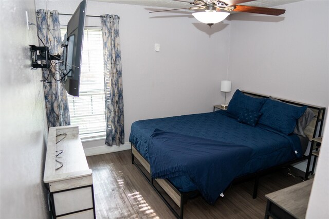 6238 Westwick Dr, Houston, TX 77072 - bedroom with wood finished floors, multiple windows, and a ceiling fan