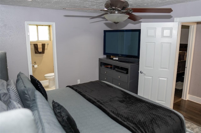 6238 Westwick Dr, Houston, TX 77072 - bedroom with wood finished floors, ceiling fan, ensuite bath, and baseboards