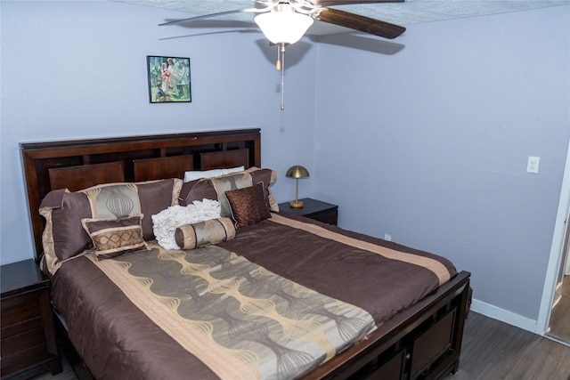6238 Westwick Dr, Houston, TX 77072 - bedroom with dark wood-style flooring, baseboards, and a ceiling fan