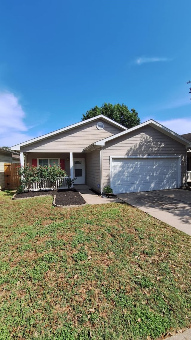 ranch-style house with an attached garage and concrete driveway