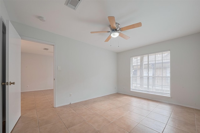 811 Wax Myrtle Ln Unit A, Houston, TX 77079 - unfurnished room featuring light tile patterned flooring, ceiling fan, a smoke detector, and baseboards