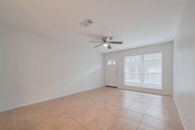 811 Wax Myrtle Ln Unit A, Houston, TX 77079 - unfurnished room featuring ceiling fan, light tile patterned floors, and baseboards
