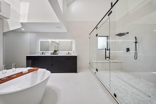 2135 Quenby St, Houston, TX 77005 - bathroom featuring a shower stall, a freestanding tub, and double vanity