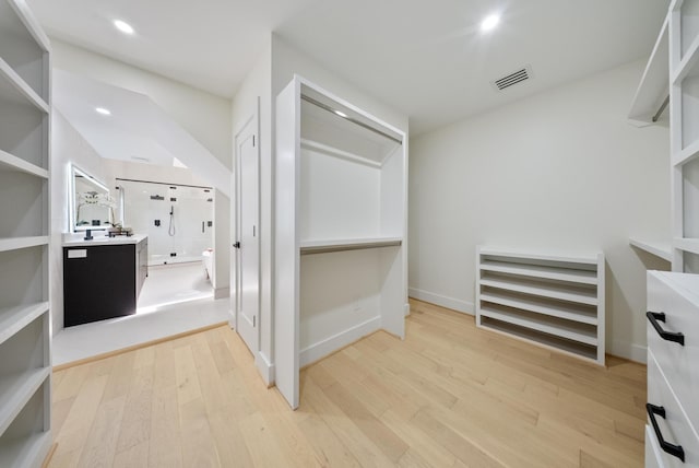 2135 Quenby St, Houston, TX 77005 - spacious closet featuring light wood-style floors