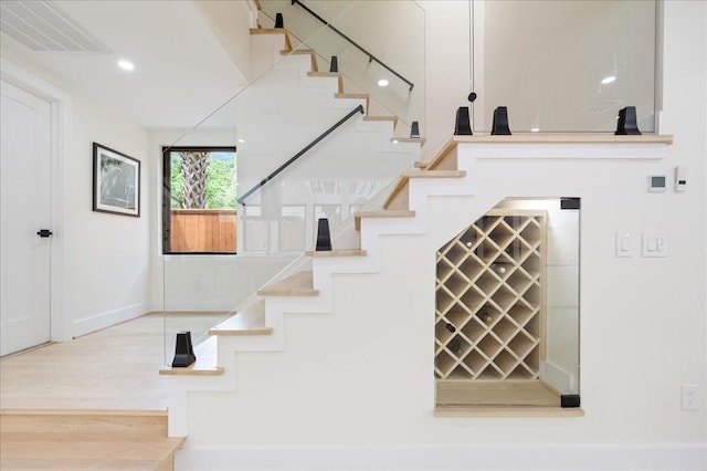 2135 Quenby St, Houston, TX 77005 - stairs with baseboards and wood finished floors