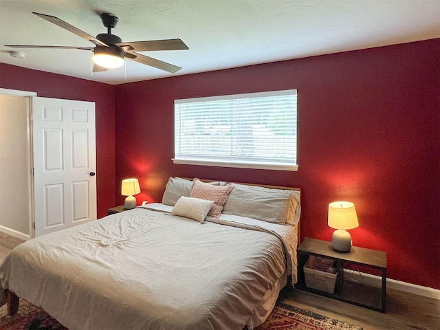 6019 Lawn Ln, Houston, TX 77088 - bedroom featuring wood finished floors and a ceiling fan