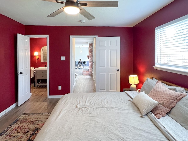 6019 Lawn Ln, Houston, TX 77088 - bedroom featuring wood finished floors and a ceiling fan