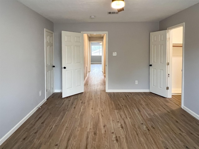 6019 Lawn Ln, Houston, TX 77088 - empty room featuring wood finished floors and a smoke detector