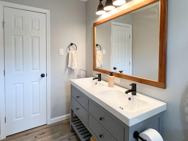 6019 Lawn Ln, Houston, TX 77088 - bathroom with double vanity and wood finished floors