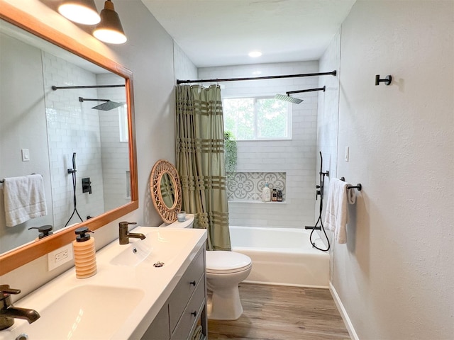 6019 Lawn Ln, Houston, TX 77088 - full bath featuring shower / tub combo with curtain, double vanity, and wood finished floors