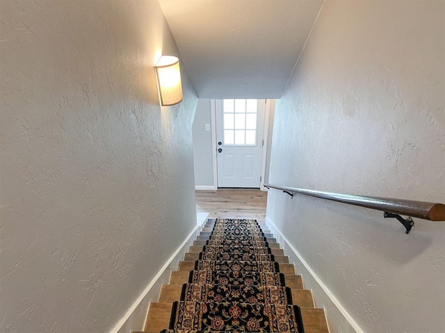 6019 Lawn Ln, Houston, TX 77088 - stairway with a textured wall and wood finished floors