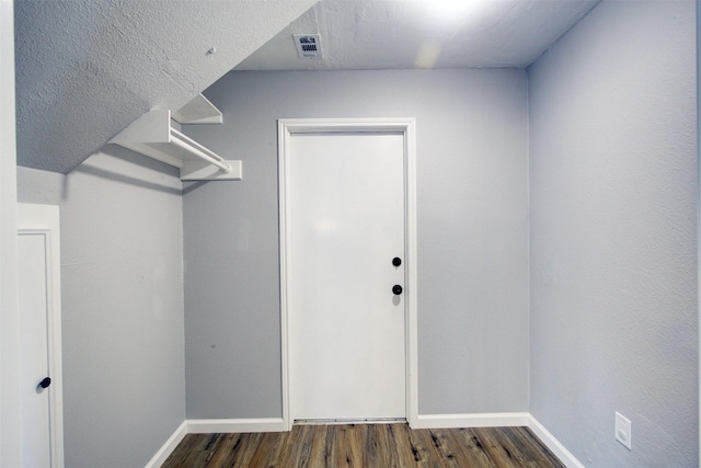 6019 Lawn Ln, Houston, TX 77088 - walk in closet with dark wood finished floors