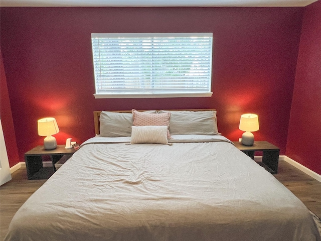 6019 Lawn Ln, Houston, TX 77088 - bedroom with wood finished floors and baseboards