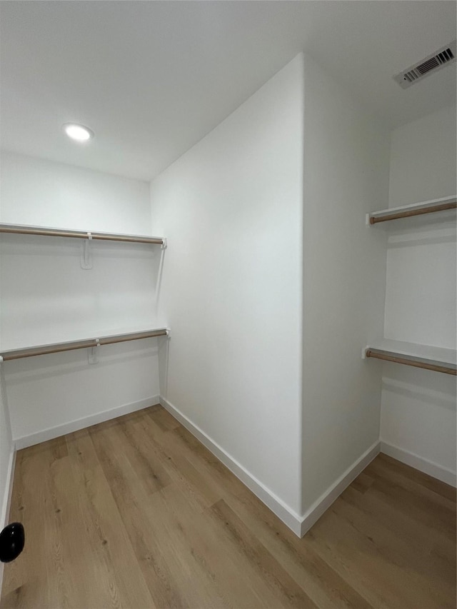 8605 Wileyvale Rd, Houston, TX 77016 - walk in closet with wood finished floors