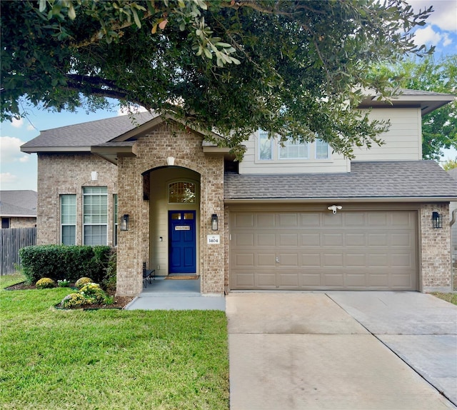 1404 Laguna Cv, Hutto, TX 78634 - view of front facade with brick siding, concrete driveway, a shingled roof, and a garage