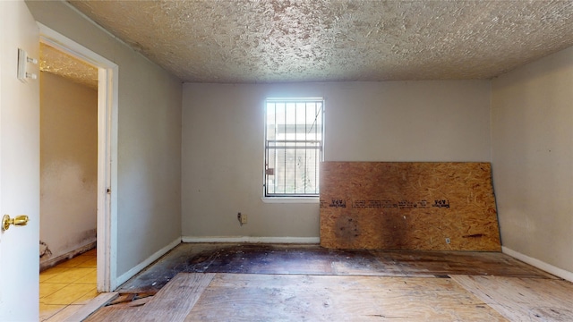 4618 Mallow St, Houston, TX 77051 - unfurnished room with a textured ceiling and baseboards