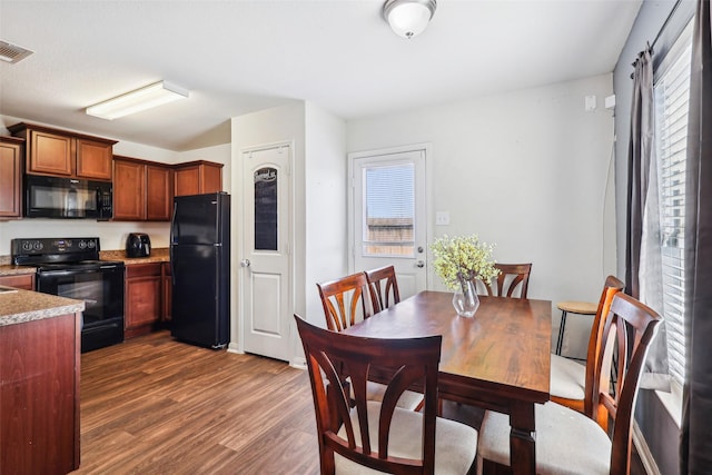 6138 Hidden Cove Rd, Baytown, TX 77523 - dining area featuring dark wood finished floors