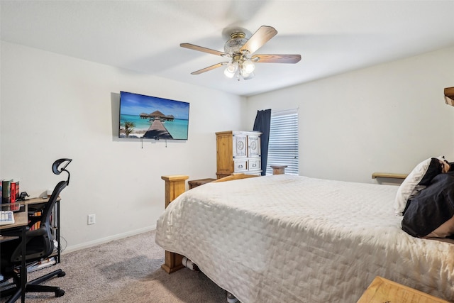 6138 Hidden Cove Rd, Baytown, TX 77523 - carpeted bedroom with baseboards, an office area, and a ceiling fan