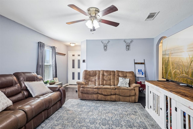6138 Hidden Cove Rd, Baytown, TX 77523 - living area featuring ceiling fan and arched walkways