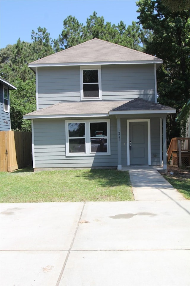 16946 W Lynbrook, Montgomery, TX 77316 - view of front of home featuring roof with shingles and a patio
