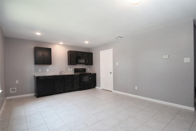 16946 W Lynbrook, Montgomery, TX 77316 - kitchen with black appliances, recessed lighting, light tile patterned flooring, baseboards, and light stone countertops