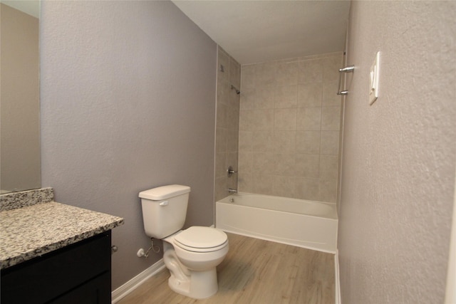 16946 W Lynbrook, Montgomery, TX 77316 - full bath with wood finished floors, toilet, vanity, shower / tub combination, and baseboards